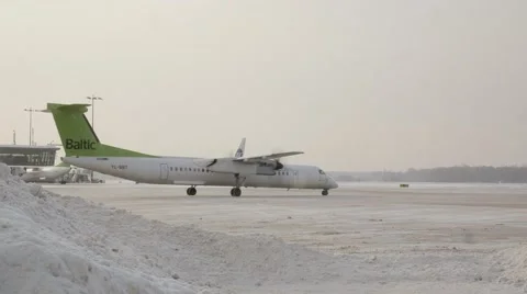 Airplain moving to runway in winter Stock Footage 60127787