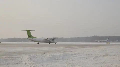 Airplain moving to runway in winter Stock Footage 60127812