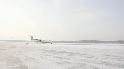 Airplain moving to runway in winter Stock Footage 60129313