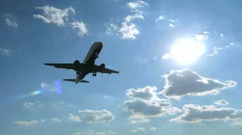 Airplane 720 60P flying overhead landing aproaching airport Stock Footage