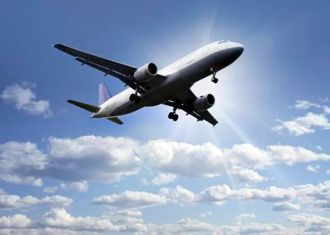 Airplane above the clouds Stock Photos
