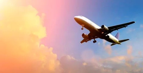 Airplane above the clouds Stock Photos