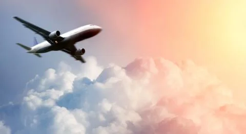 .airplane above the clouds Stock Photos