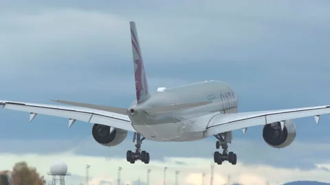 Airplane airbus 350 qatar airways landing stunning rear view wheels touchdown Stock Footage 141678700