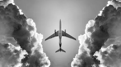 Airplane and cloud Stock Photos