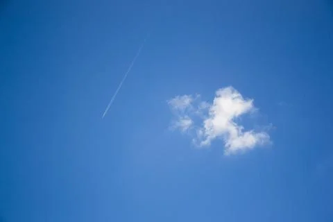 Airplane and cloud in the sky Stock Photos