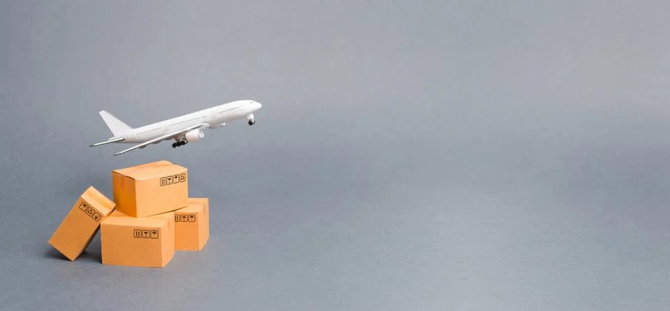 Airplane and stack of cardboard boxes. concept of air cargo and parcels, airm 写真素材