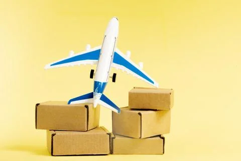 Airplane and stack of cardboard boxes. concept of air cargo and parcels, airm 写真素材