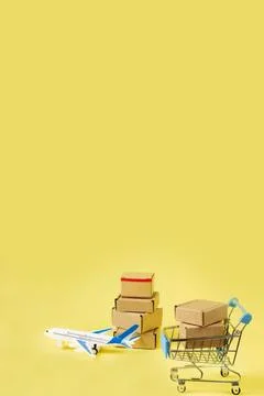 Airplane and stack of cardboard boxes. concept of air cargo and parcels, airm Stock Photos