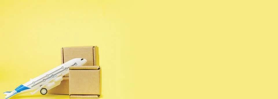 Airplane and stack of cardboard boxes. concept of air cargo and parcels, airm 스톡 사진