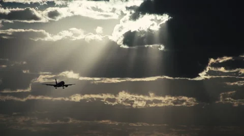 Airplane on  approach flight in a cloudy  sky Stock Footage 50486780