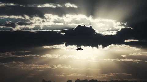 Airplane on  approach flight in a eventide cloudy  sky Stock Footage 50486991