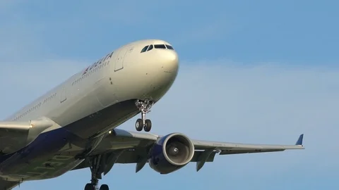 Airplane on approach in slow motion Stock Footage 114453674