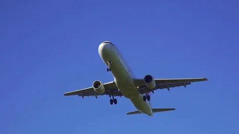 Airplane approaching the airport runway for landing Stock Footage