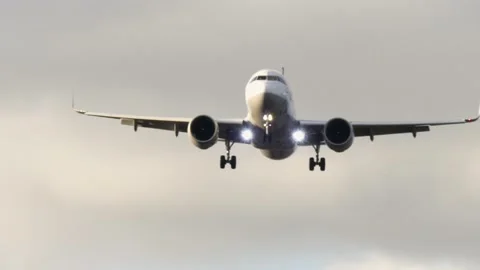 Airplane approaching the Airport at sunset Stock Footage 162401880