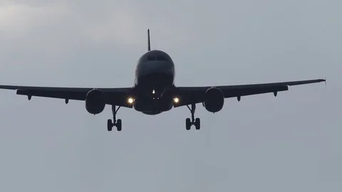 Airplane approaching for landing, front view Stock Footage 90086970