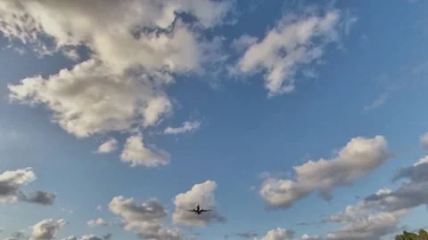 Airplane approaching the landing runway at sunset, Below view Stock Footage 162394525