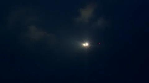 Airplane approaching through thick clouds at night Stock Footage 290521961