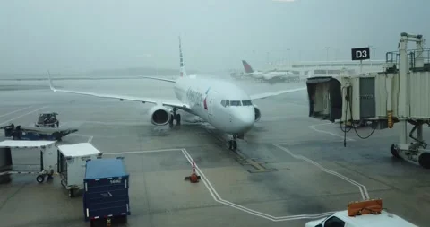 Airplane arrival in the rain Stock Footage 161032294