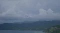 Airplane arriving Flores island coast while raining season 4k or 4k+ Resolution