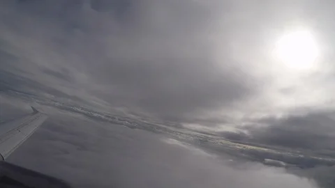 Airplane ascending between clouds Stock Footage 88894113