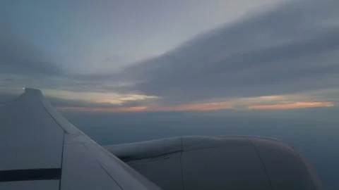 Airplane Ascending at Sunset Time-lapse from Passenger Window Stock Footage 346667660
