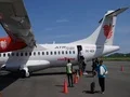 Airplane ATR 72-600 Turboprop tourists arrive at Komodo Airport 4k or 4k+ Resolution
