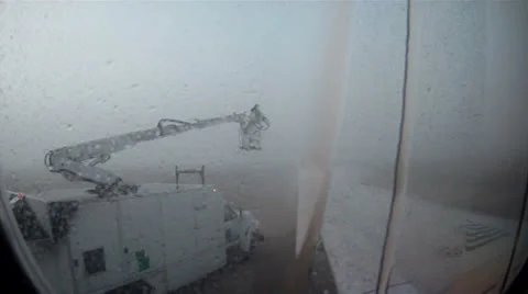 Airplane being de-iced in bad weather Video stock 24658080