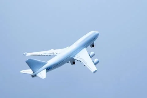 Airplane on blue background Stock Photos