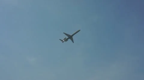 Airplane on blue sky background Видео 10877978