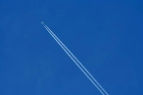 Airplane in the blue sky Stock Photos