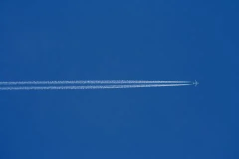 Airplane in the blue sky Stock Photos