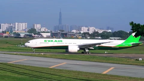 Airplane Boeing 777 of EVA Air moving to runway prepare take off Stock Footage 133021953
