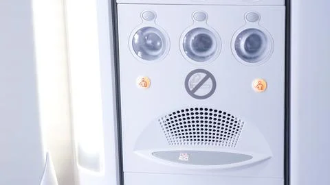 Airplane cabin control panel featuring buttons and indicators, designed for Stock Photos