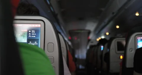 Airplane Cabin with In-Flight Entertainment Screen Video stock 332458771