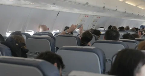 Airplane cabin full of passengers Stock Footage 74109407