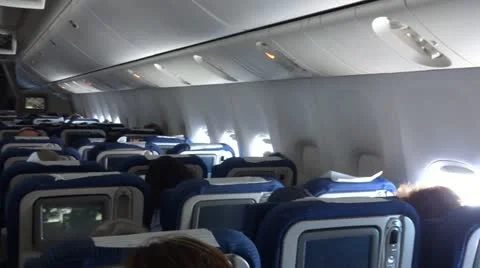 Airplane cabin with passengers 스톡 동영상 12467894