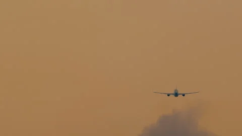 The airplane is climbing during sunset Stock Footage 250283229