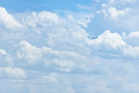 Airplane in Cloudy Sky with Copy Space for Travel Concept Stock Photos