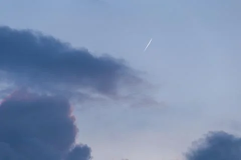 Airplane on the cloudy sky Stock Photos