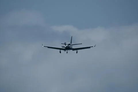 Airplane in the cloudy sky. Foto stock