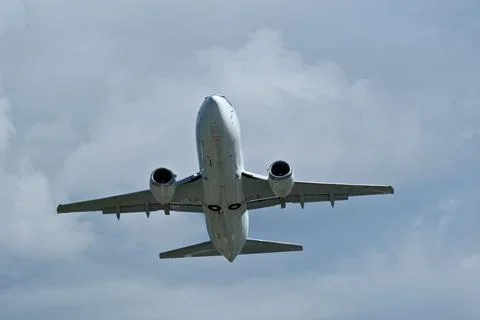 Airplane in the cloudy sky. Foto stock