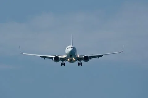 Airplane in the cloudy sky. Foto stock