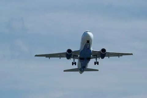 Airplane in the cloudy sky. Foto stock