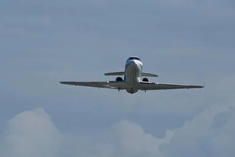 Airplane in the cloudy sky. Foto stock