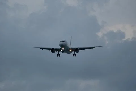 Airplane in the cloudy sky. Foto stock