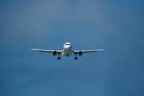Airplane in the cloudy sky. Foto stock