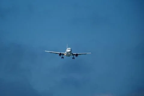 Airplane in the cloudy sky. Foto stock