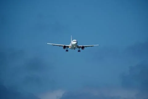 Airplane in the cloudy sky. Foto stock