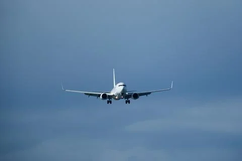 Airplane in the cloudy sky. Foto stock